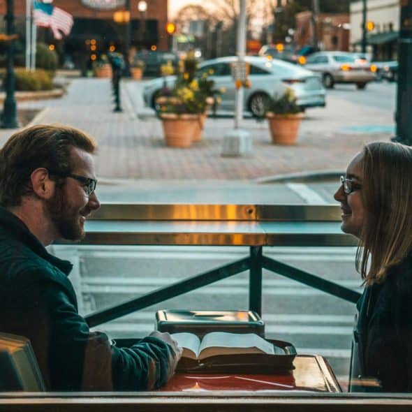 A man and woman looking at each other