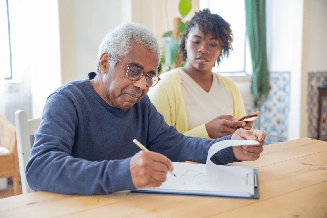 A man writing on a paper