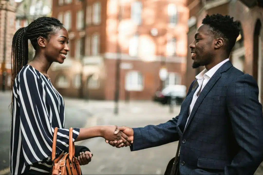 A man and woman shaking hands