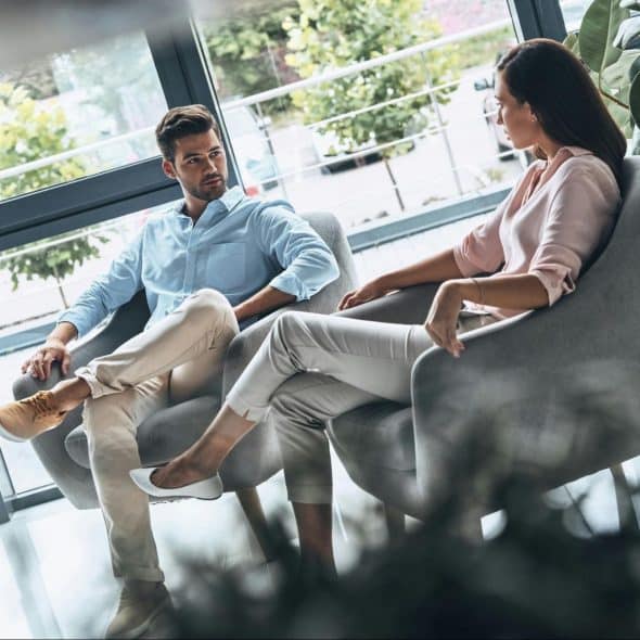 A man and woman looking at each other