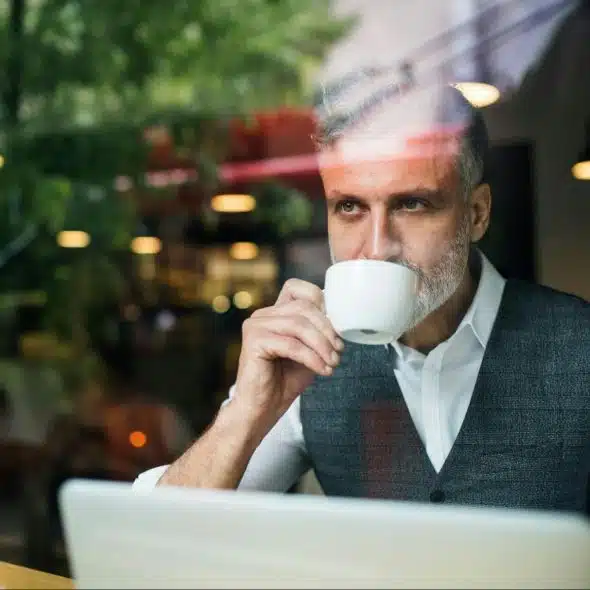 A man sipping coffee