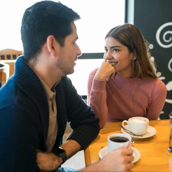 A man and woman having a coffee