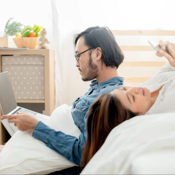 A man and woman at their bedroom