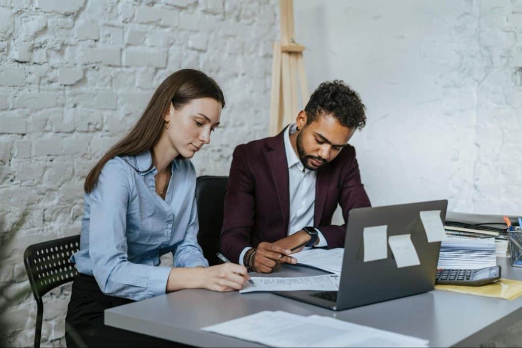 A man and woman being silent during work