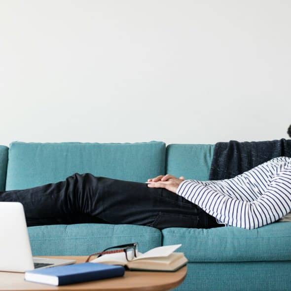 A man sleeping on the couch