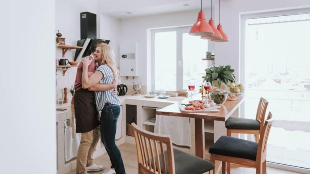 Man lightening house chores  for his partner without needing cues.