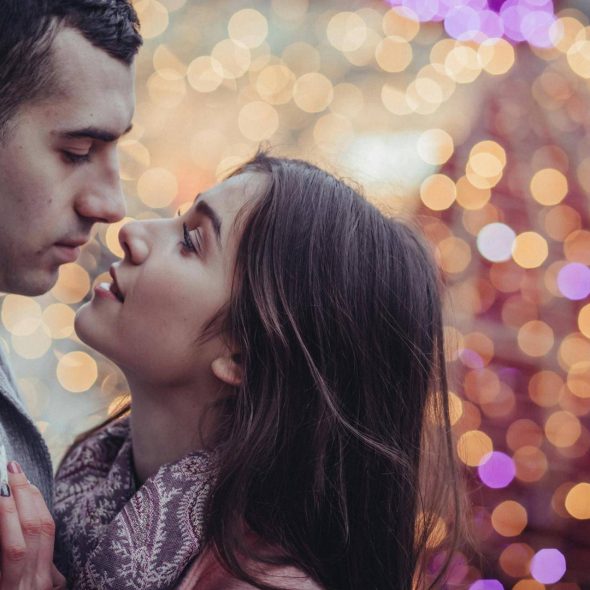 A couple about to kiss.