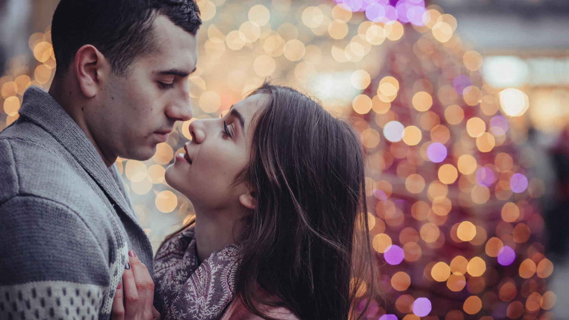A couple about to kiss.