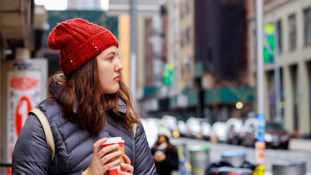A woman drinking coffee.