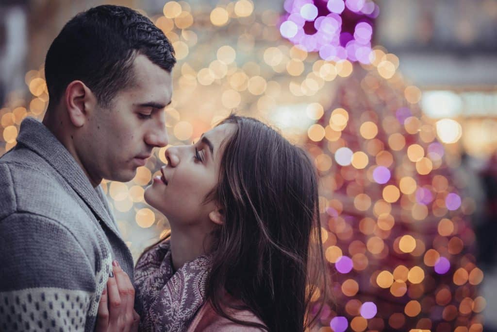 A couple about to kiss.