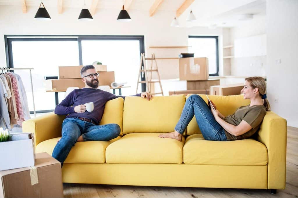 A man and woman at the couch