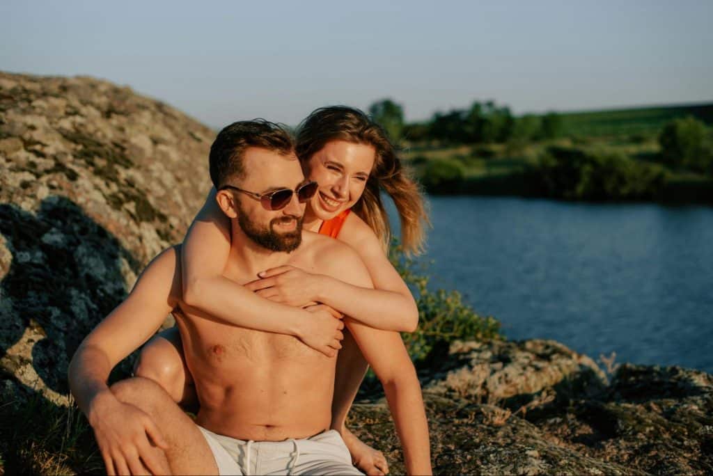 A woman hugging a man