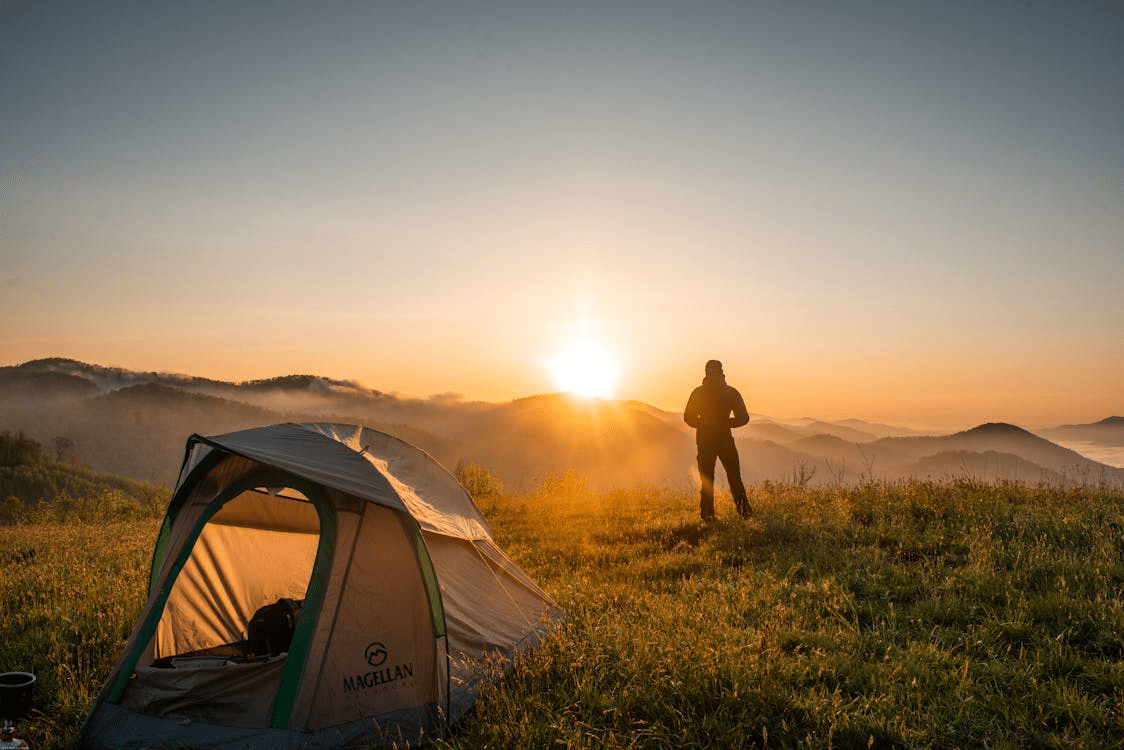 A person near camping tent