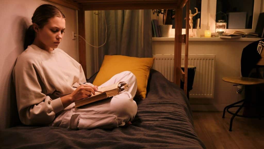 A woman reading in bed at night