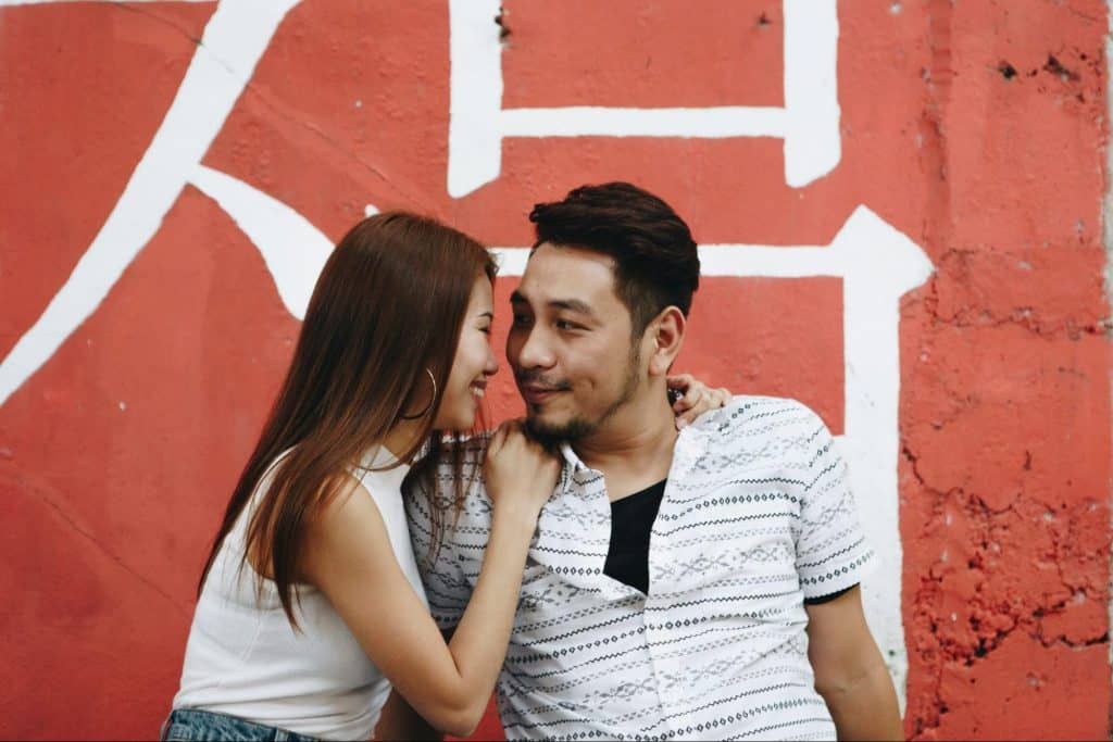 A man and woman smiling at each other