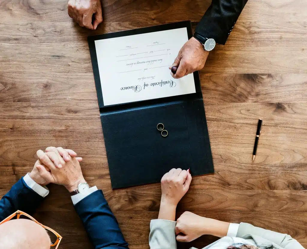 A person stamping the certificate of divorce.