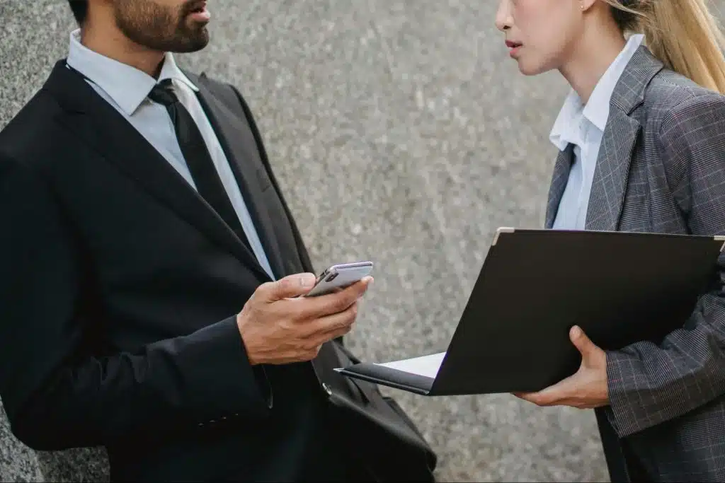 A woman trying to get help from a man