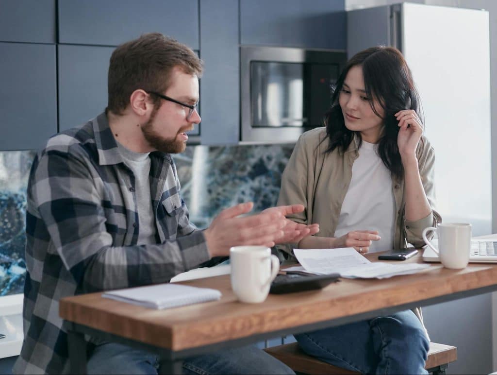 A man interrupting a talking woman