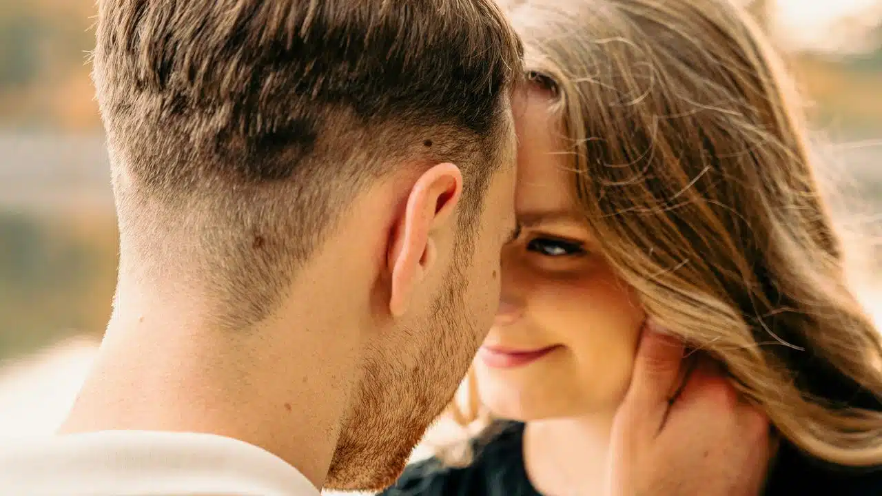 A close-up of a couple sharing an intimate moment.