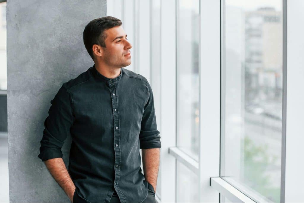 A man looking at the window