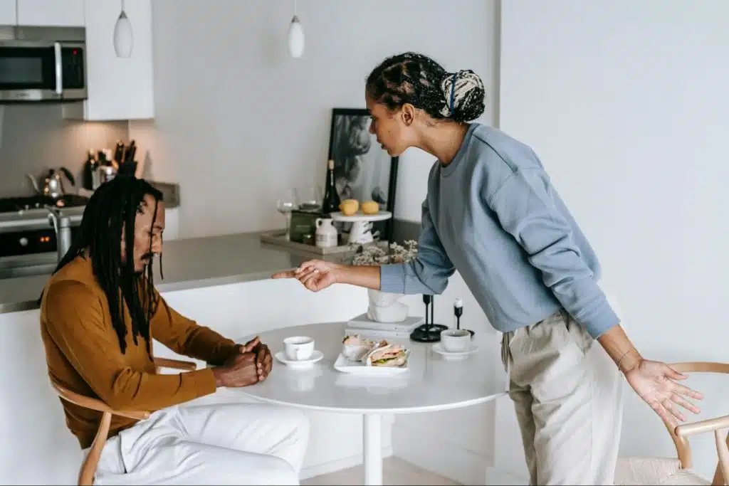 A woman trying to talk with her husband