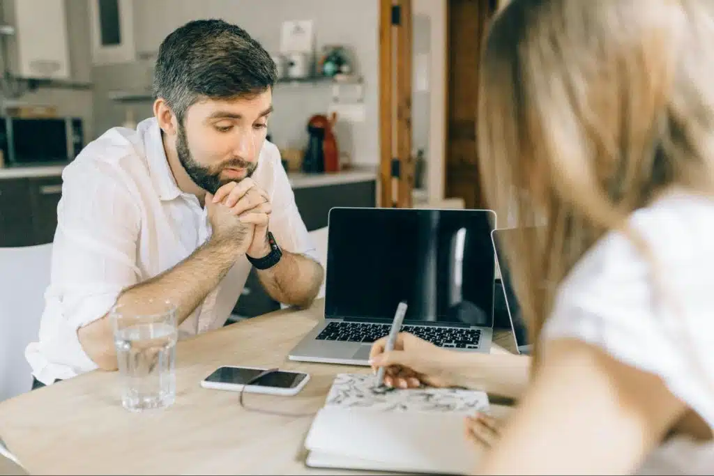 A man trying to speak with a woman