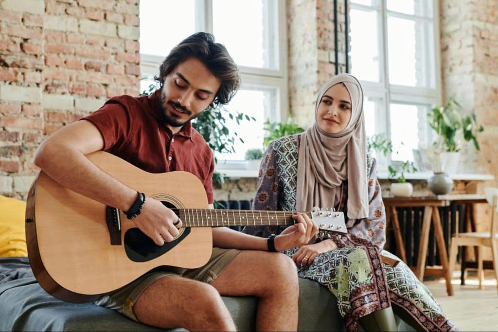 A man playing a guitar