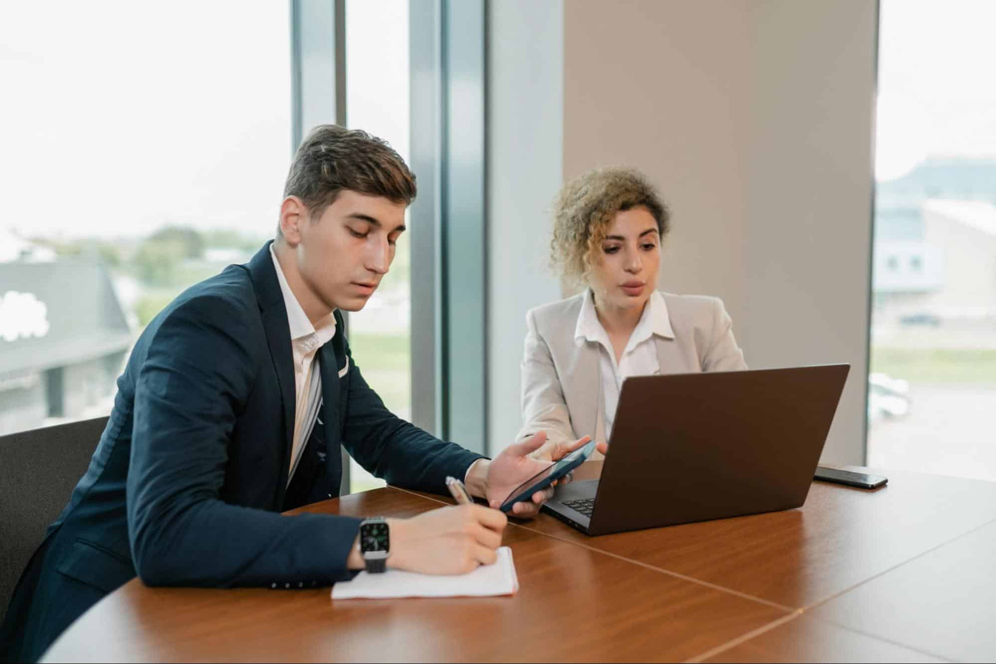 A man and woman busy with their work