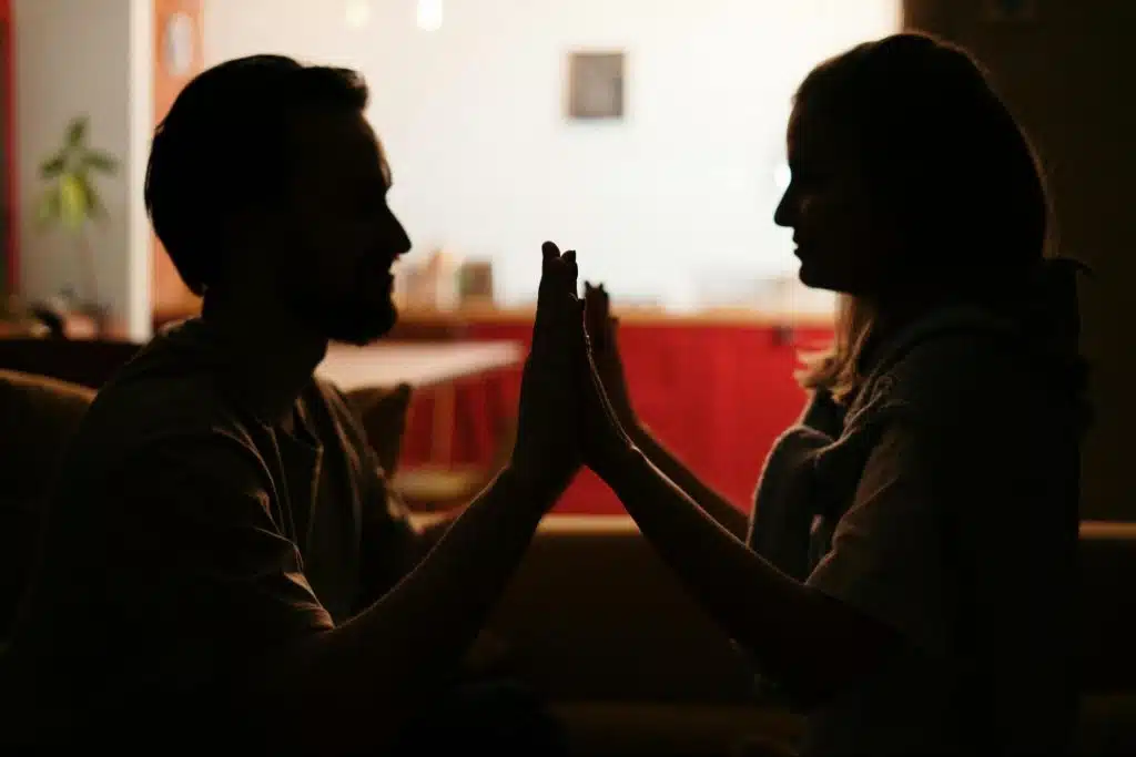 A man and woman facing each other