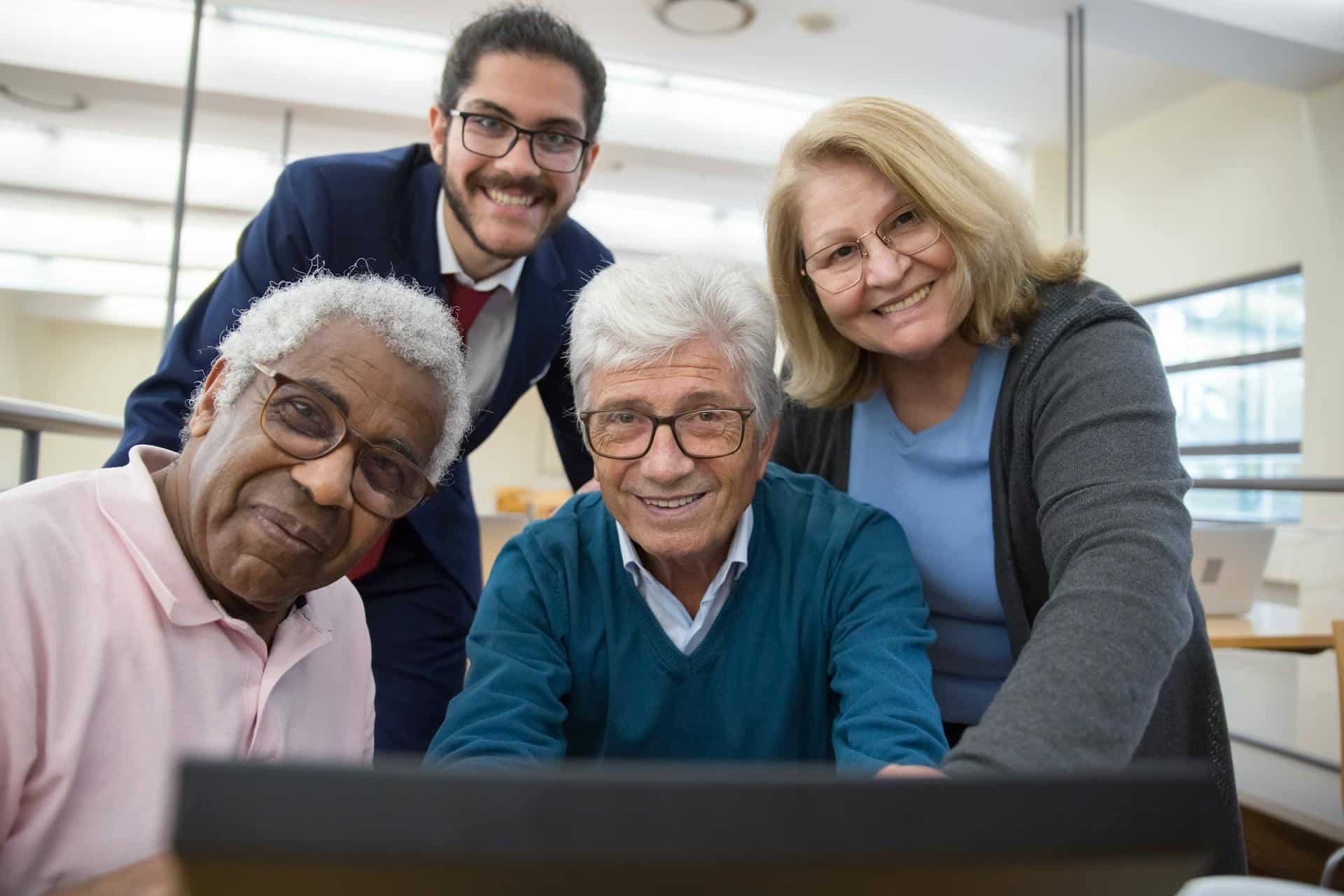 A group of people smiling wearing eyeglasses.