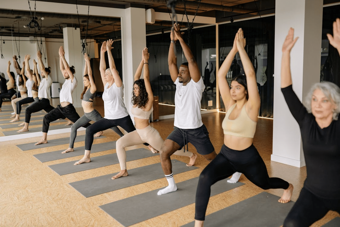 A group of people doing yoga exercises.