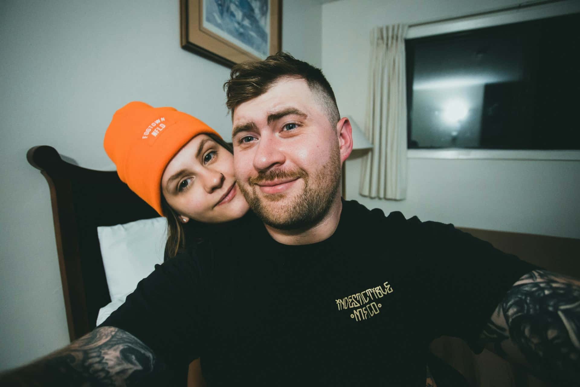 A man and woman posing for a picture.