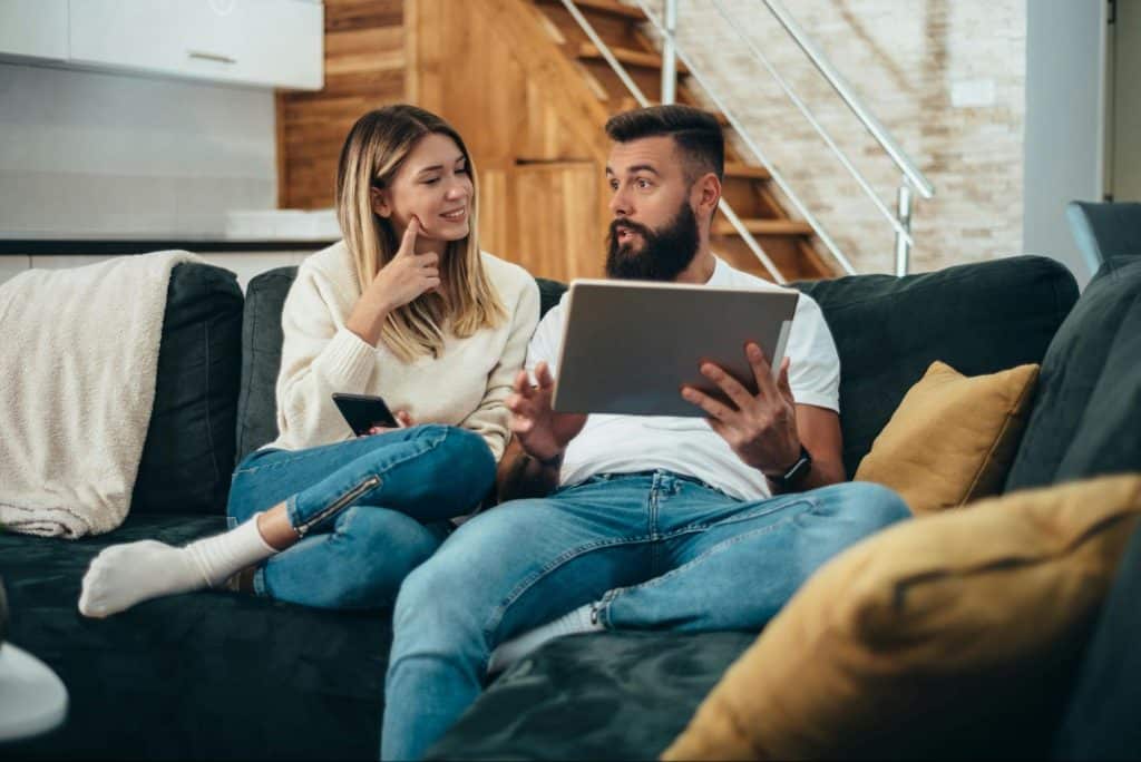 A man and woman at the couch