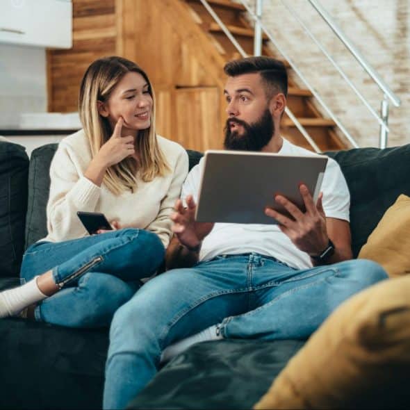 A man and woman at the couch