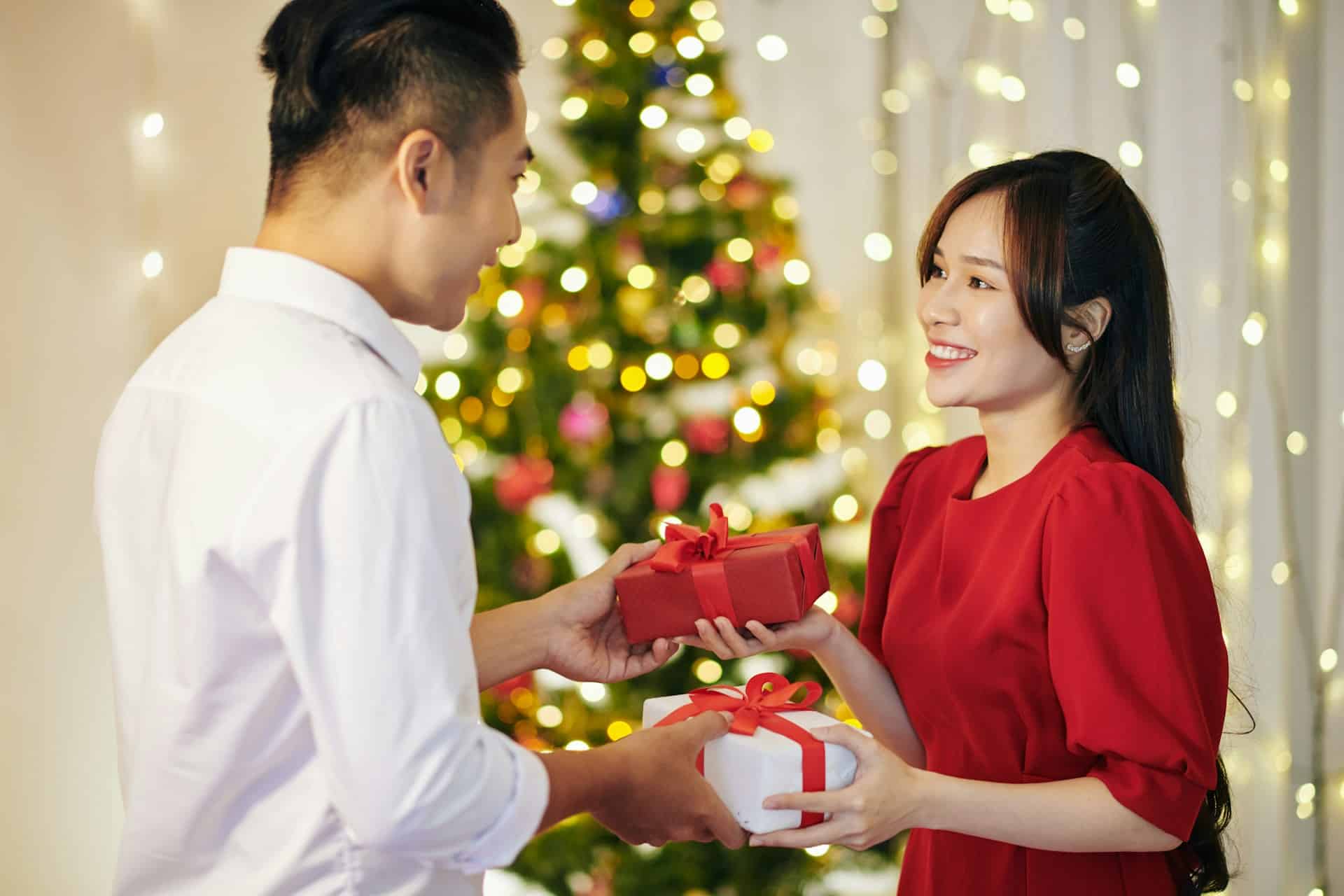 A couple giving gifts to each other.