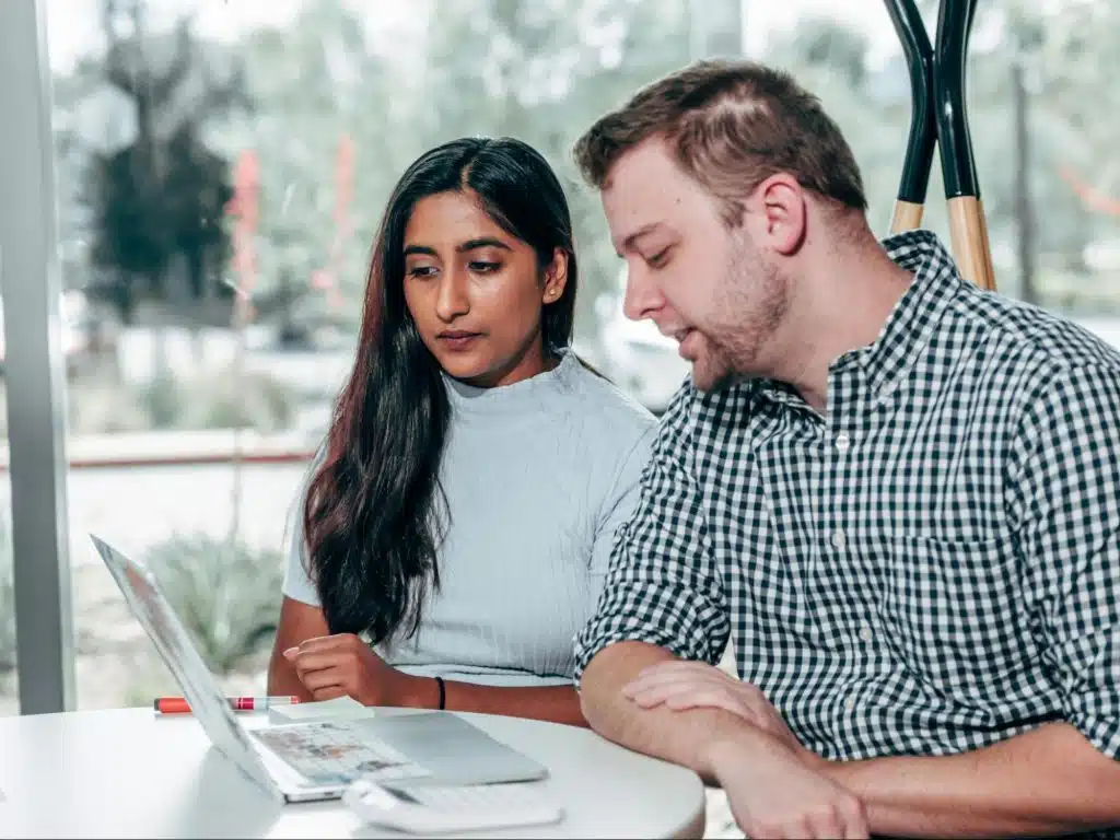 A woman listening to a man