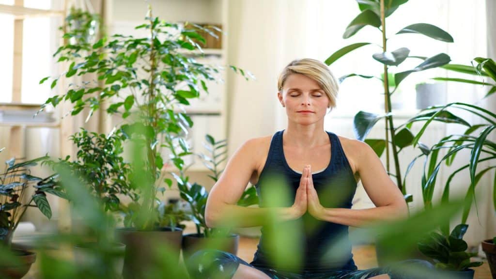 A woman doing yoga at home