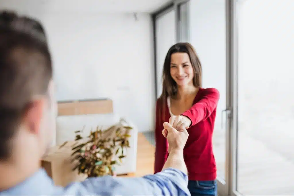 A man holding woman’s hand 