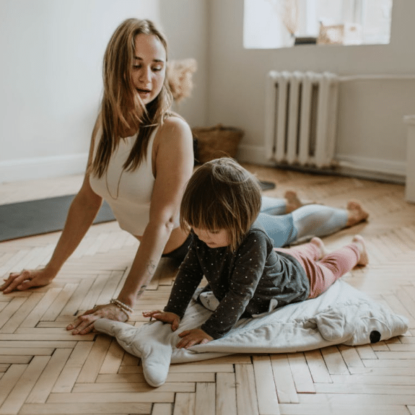 A mother and child doing yoga