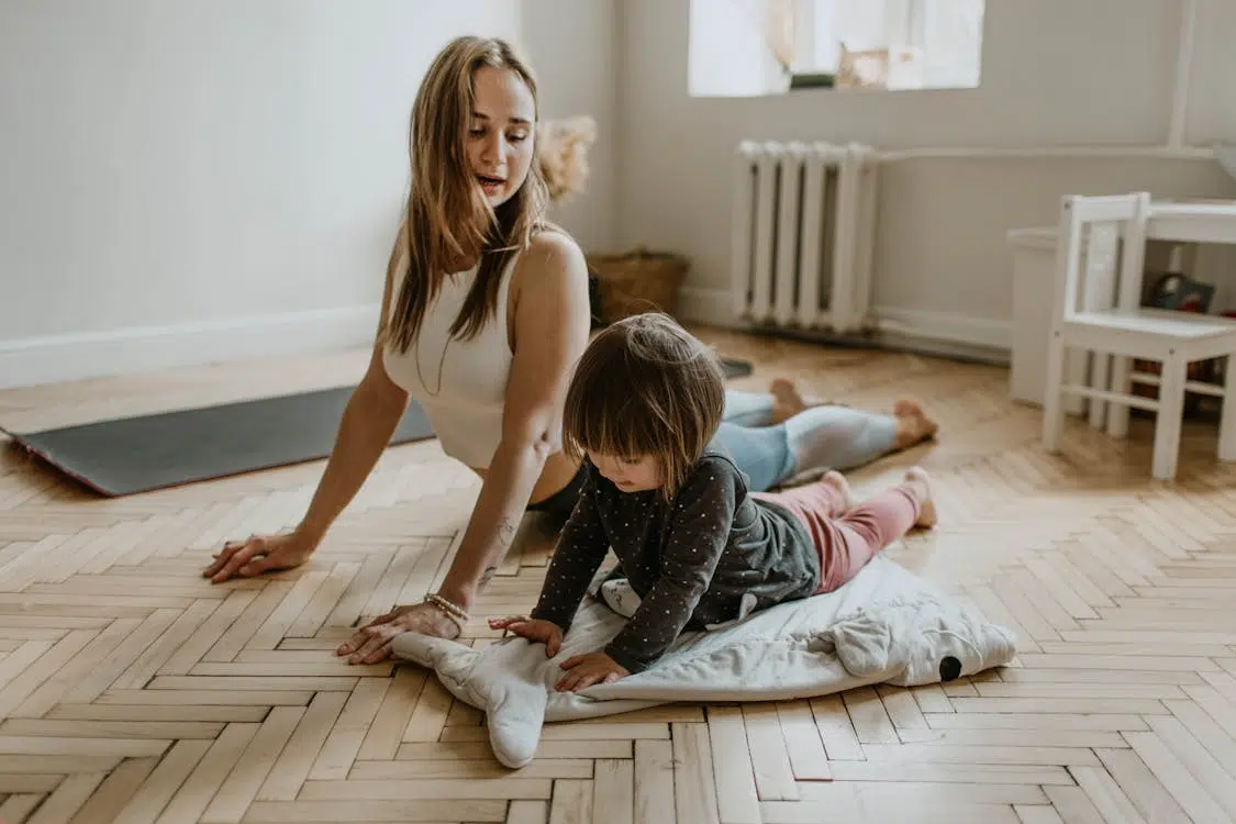 A mother and child doing yoga