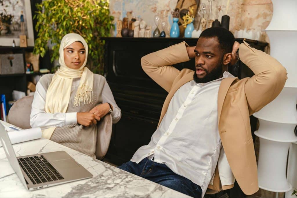 A man resting his back and a woman looking at him