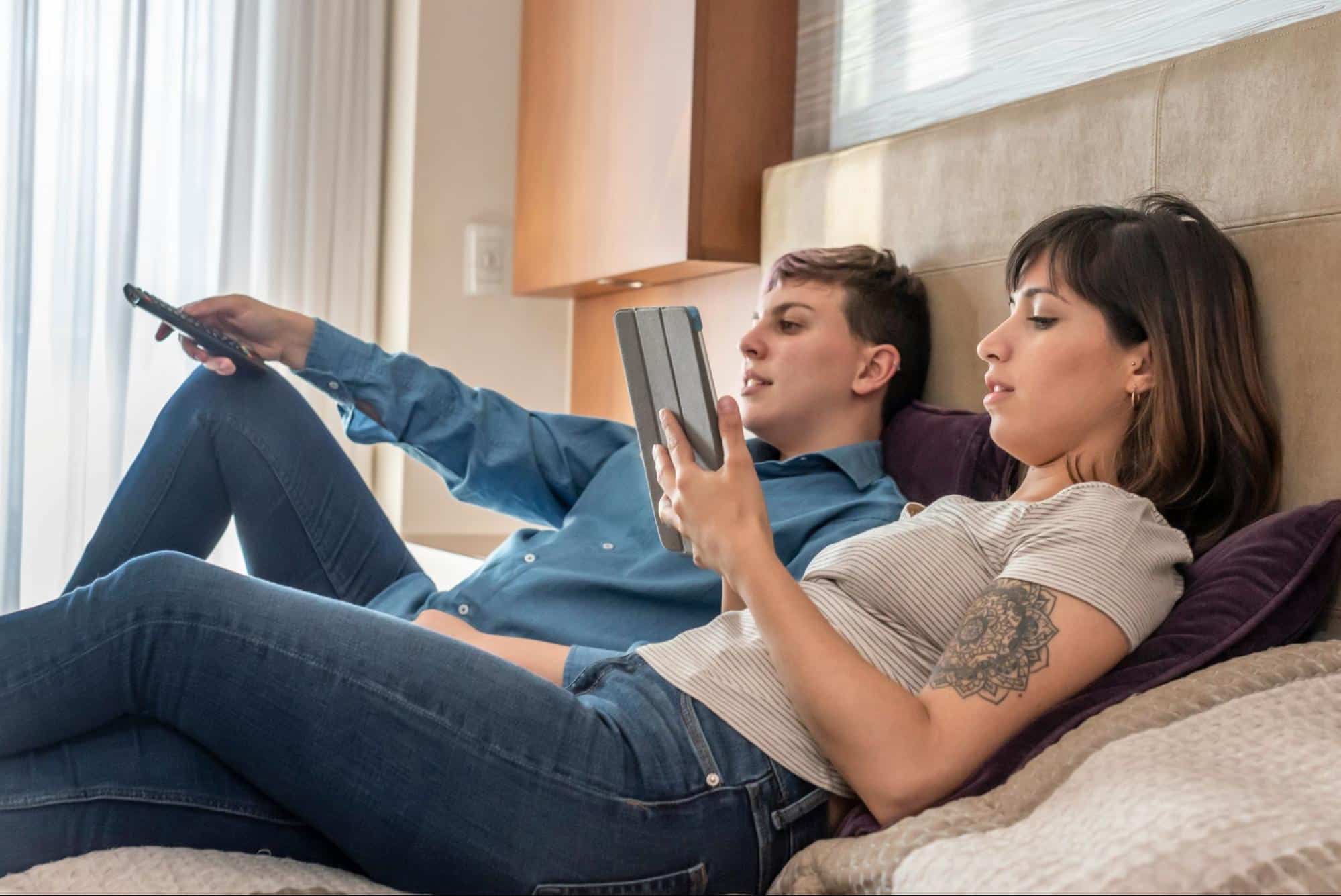 A man and woman at the bed
