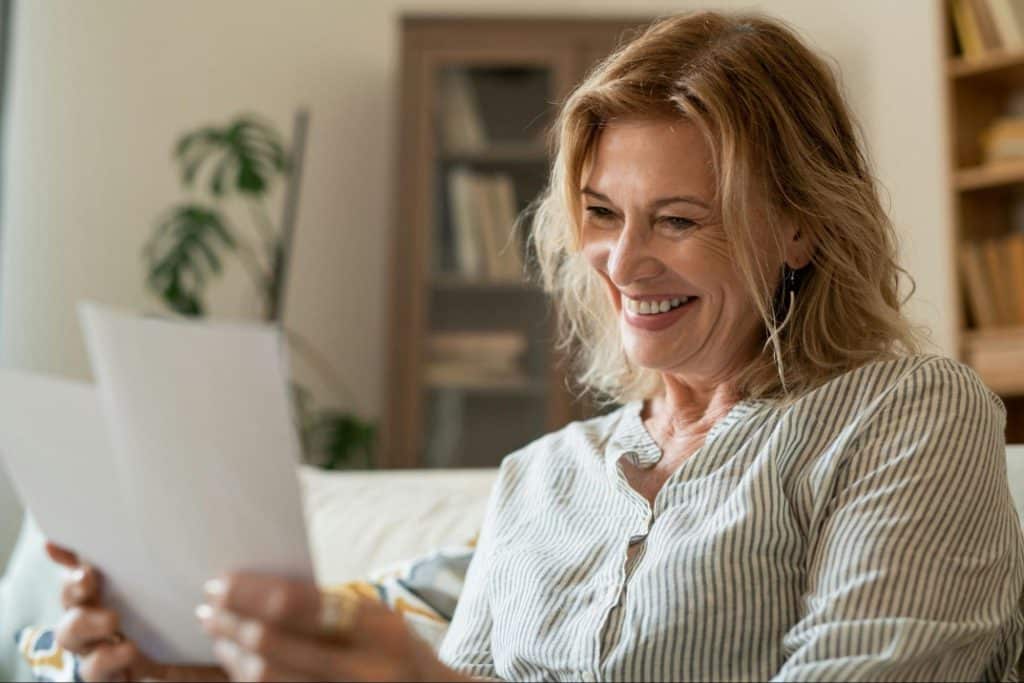 A woman happy while looking at the pictures