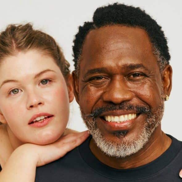 A man and a woman posing for a picture.