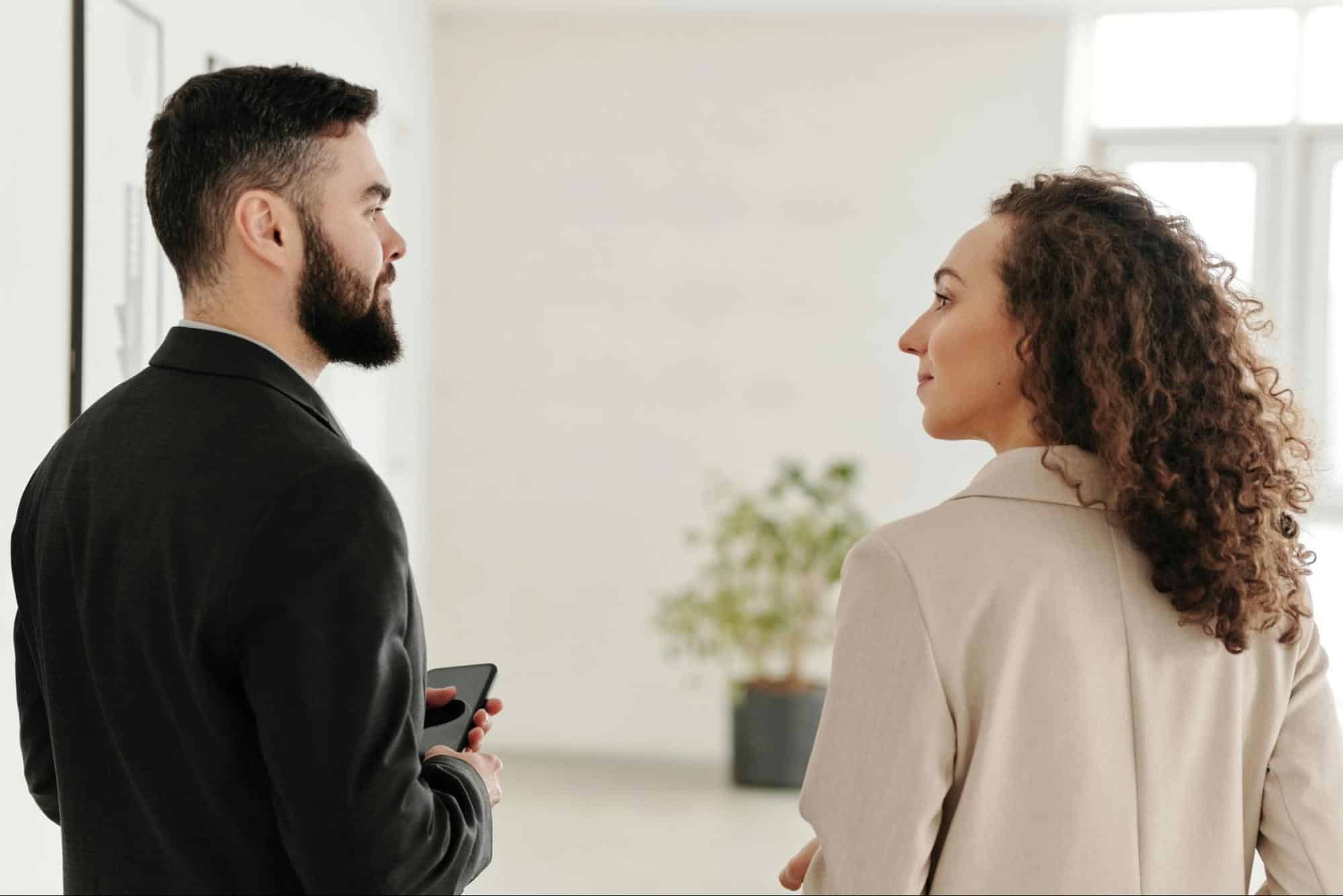 A man and woman looking at each other 