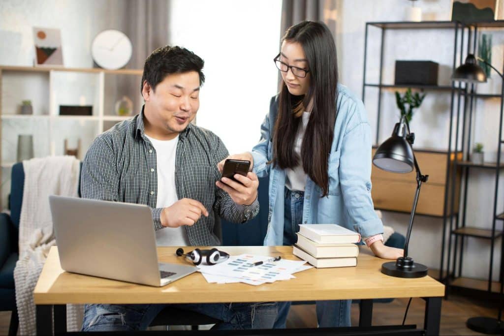 A man showing something and a woman does not talk