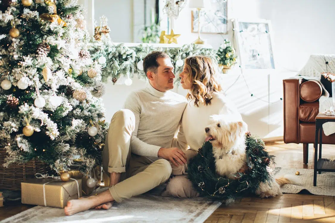 A man and a woman with a dog