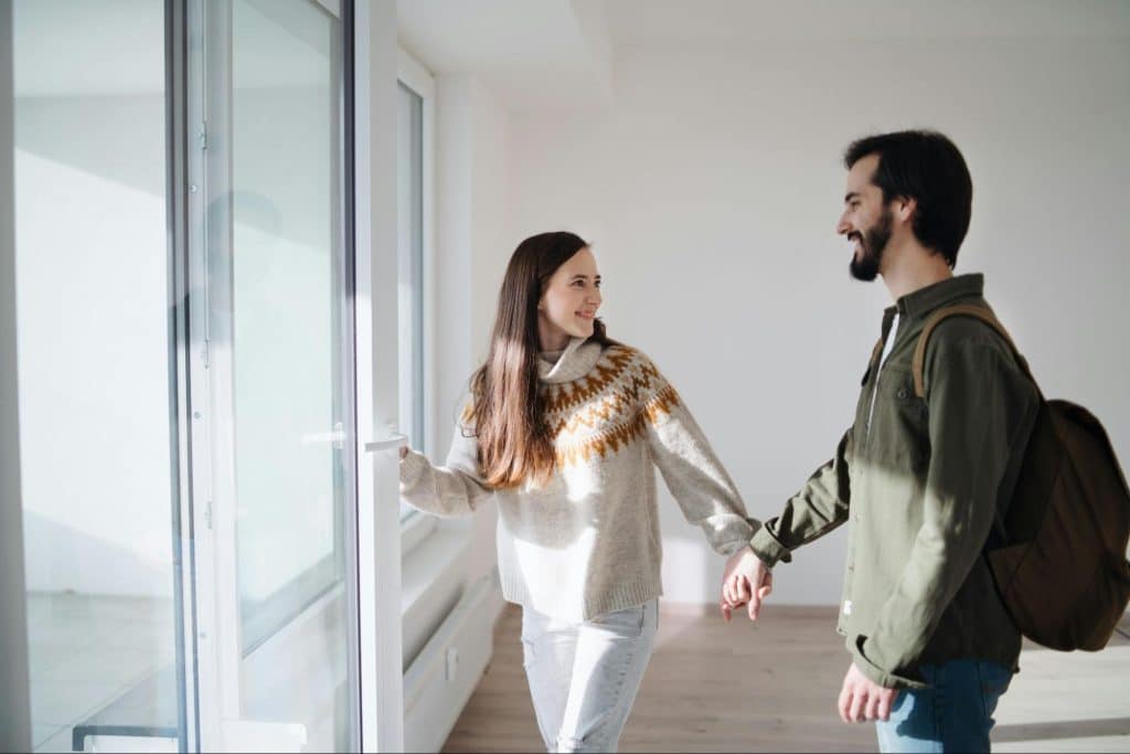 A woman holding the hands of a man