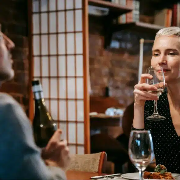 A woman looking at the man