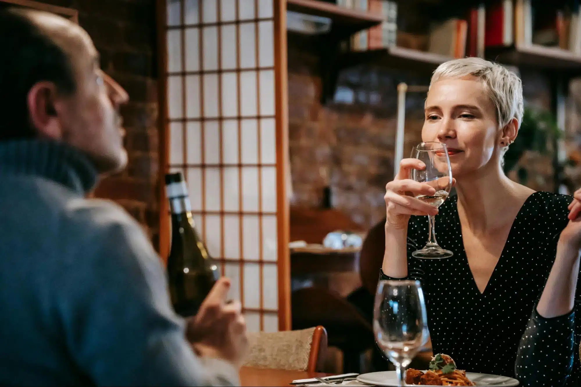 A woman looking at the man